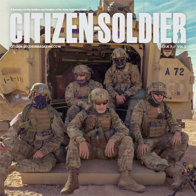 Citizen-Soldier Magazine cover; five soldiers wearing camouflage fatigues and helmets with sunglasses are sitting down outside.