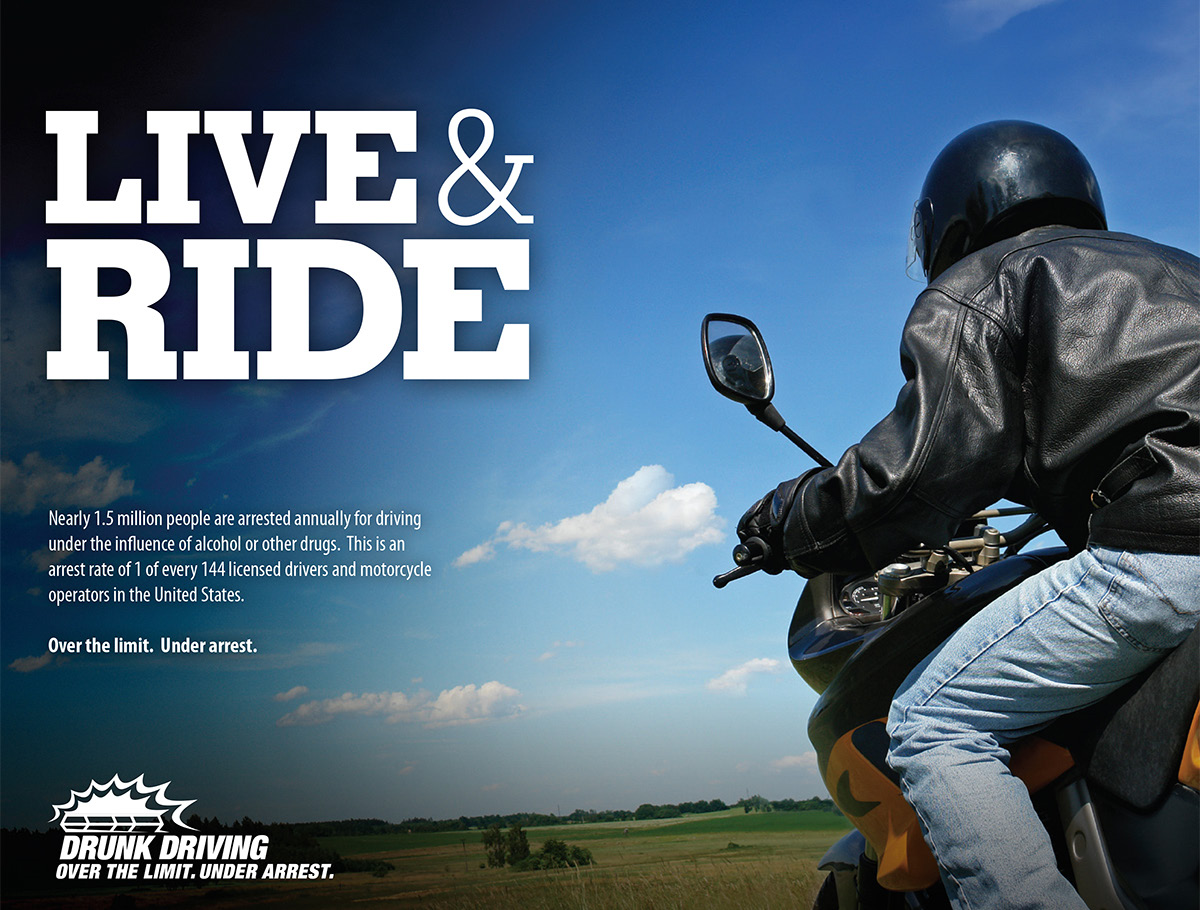 Person with a black jacket and helmet rides a motorcycle on a “Live & Ride” poster designed for the “Drunk Driving Over the Limit. Under Arrest” campaign.