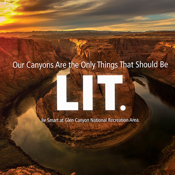 Our canyons are the only things that should be lit. Be Smart at Glen Canyon National Recreation Area. The background features a picture of a sunset over a canyon.